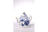 A BLUE AND WHITE TEAPOT AND COVER
