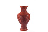 A LARGE CINNABAR LACQUER 'SCHOLARS' VASE