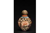 A CHINESE CANTON ENAMEL 'PEONIES' SNUFF BOTTLE