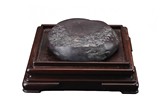 A VERY LARGE INKSTONE WITH HARDWOOD STAND