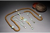 A CHINESE AGARWOOD AND JADEITE BEAD COURT NECKLACE