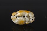 A RETICULATED WHITE JADE CARVING OF ANIMAL 