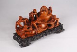 A BOXWOOD CARVED LUOHAN AND BOYS GROUP