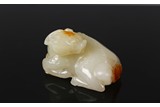 A CHINESE WHITE JADE RECUMBENT BEAT 