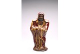 A CHINESE GLAZED PORCELAIN BODHIDHARMA FIGURE
