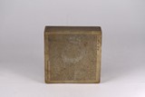 A BRONZE INSCRIBED SQUARE BOX AND COVER