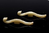 A PAIR OF ARCHAISTIC JADE BELT HOOKS