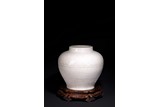 A CHINESE WHITE GLAZED INCISED JAR