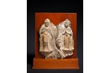 A CHINESE ARCHAIC CARVING OF TWO BUDDHIST ATTENDANTS