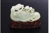 A CHINESE WHITE JADE CARVED FIGURE OF PHOENIX