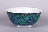 AN UNUSUALLY LARGE CHINESE GREEN ENAMEL 'DRAGONS' BOWL