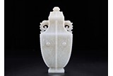 A CHINESE WHITE JADE 'TAOTIE' VASE AND COVER
