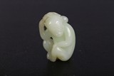 A CHINESE WHITE JADE CARVING OF MONKEY