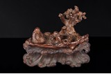 A CHINESE ALOESWOOD 'IMMORTALS' LOG RAFT CARVING