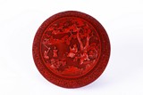 A CHINESE CINNABAR LACQUER 'SCHOLARS' CIRCULAR BOX AND COVER