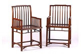 A PAIR OF HARDWOOD SPINDLE BACK ARMCHAIRS
