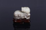 A CHINESE JADE CARVING OF RECUMBENT HORSE