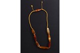 AN ARCHAIC WESTERN ASIATIC AGATE BEAD NECKLACE
