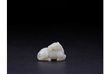 A SMALL CHINESE WHITE JADE HORSE