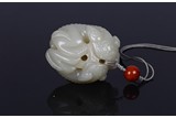 A CHINESE WHITE JADE 'TWIN BEASTS' TOGGLE