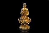 A CHINESE GILT BRONZE SEATED BUDDHA