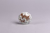 A CHINESE RED ENAMEL 'LIONS' WALL VASE