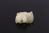 A CHINESE WHITE JADE 'PEACH AND BAT' PENDANT