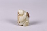 A CHINESE WHITE AND RUSSET JADE CARVING OF TWO BOYS
