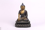 A LARGE CHINESE BRONZE AND COLD GILT FIGURE OF SHAKYAMUNI