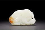 A CHINESE WHITE JADE CARVING OF BUDDHIST LION