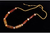 AN ARCHAIC WESTERN ASIATIC AGATE BEAD NECKLACE