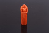 A CHINESE UNCARVED RED CORAL 'MAITREYA' SEAL