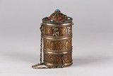 A TIBETAN GILT COPPER PRAYER WHEEL BOX