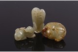 A GROUP OF THREE CHINESE JADE TOGGLES